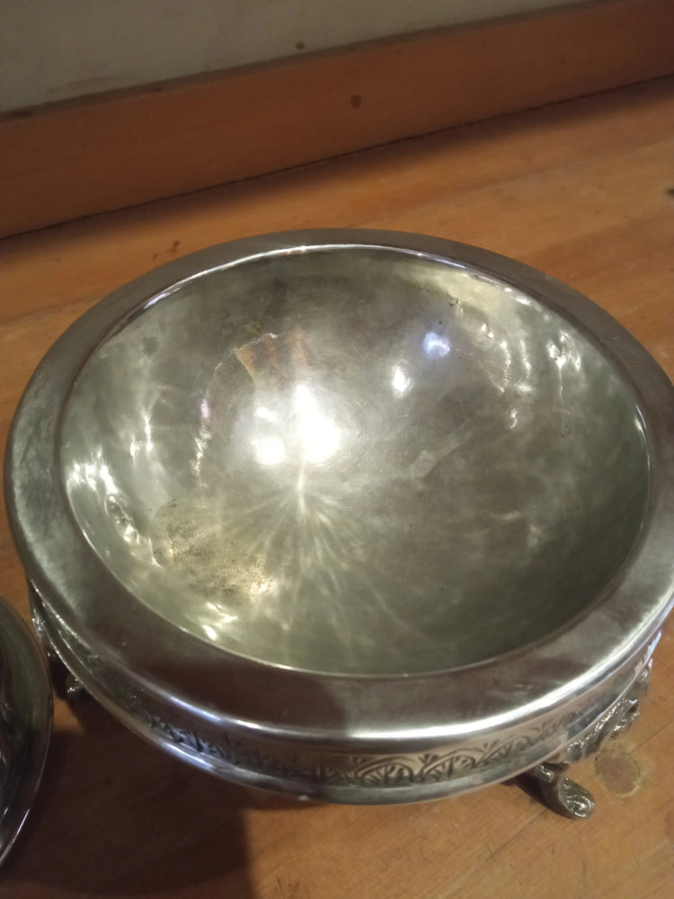 Silver decorative bowl on a wooden surface