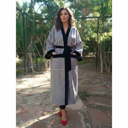 woman wearing belted oversized winter checkered coat with black velvet 