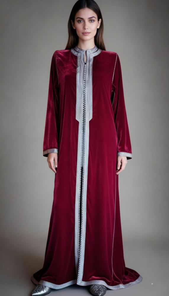 woman wearing burgundy moroccan kaftan with grey embroidery 