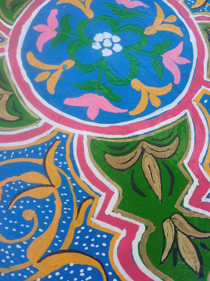 Colorful floral pattern with blue, green, pink, and orange colors.