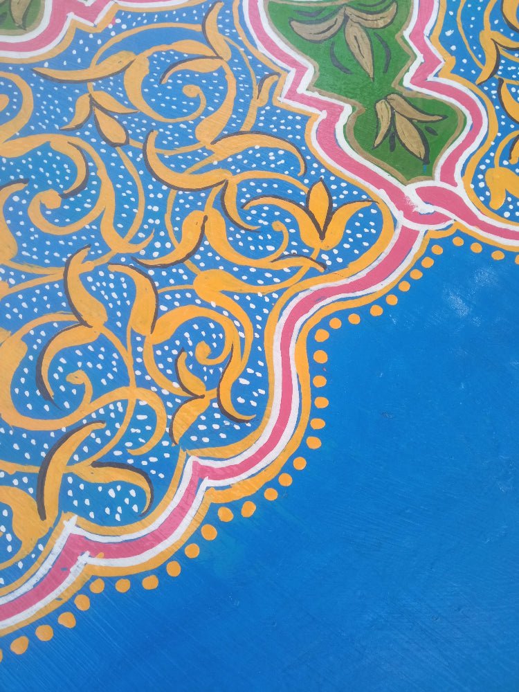 Decorative fabric with intricate patterns on a blue background