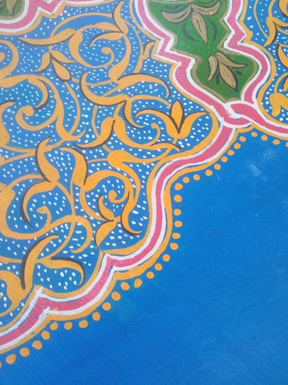 Decorative fabric with intricate patterns on a blue background