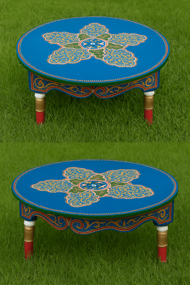 Two blue tables with decorative patterns on a grass background