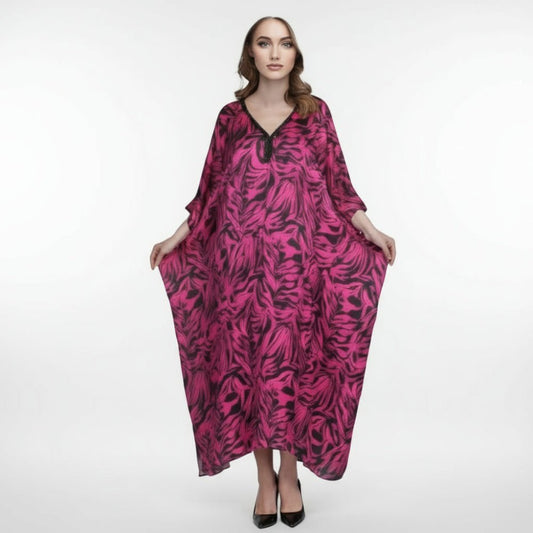 Woman wearing a pink and black patterned dress on a white background