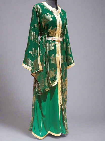 Green dress with gold accents on a mannequin 