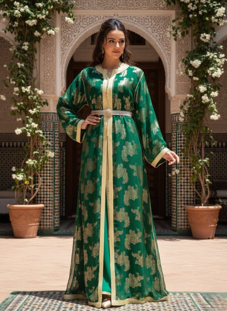 Woman in a green moroccan tlija 2piece kaftan dress standing in a decorative outdoor setting with plants and arches.