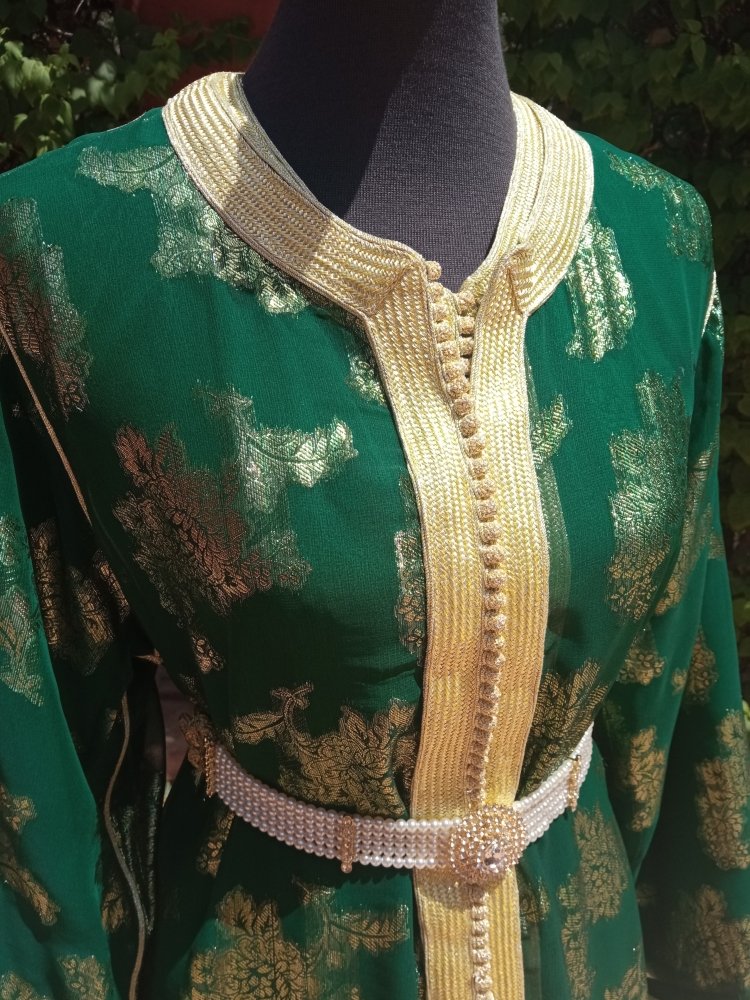 Green embroidered garment on a mannequin
