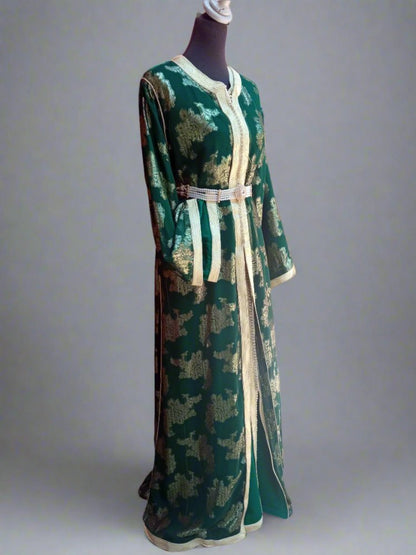 Green and gold dress on a mannequin 