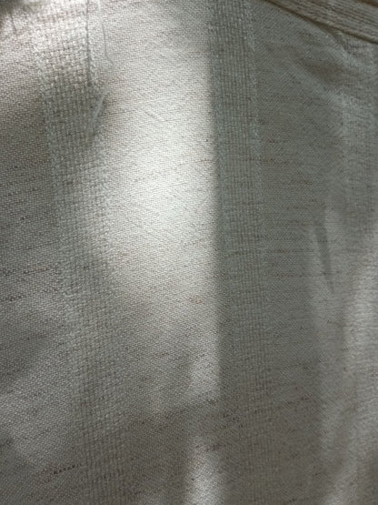 Close-up of a textured beige fabric surface