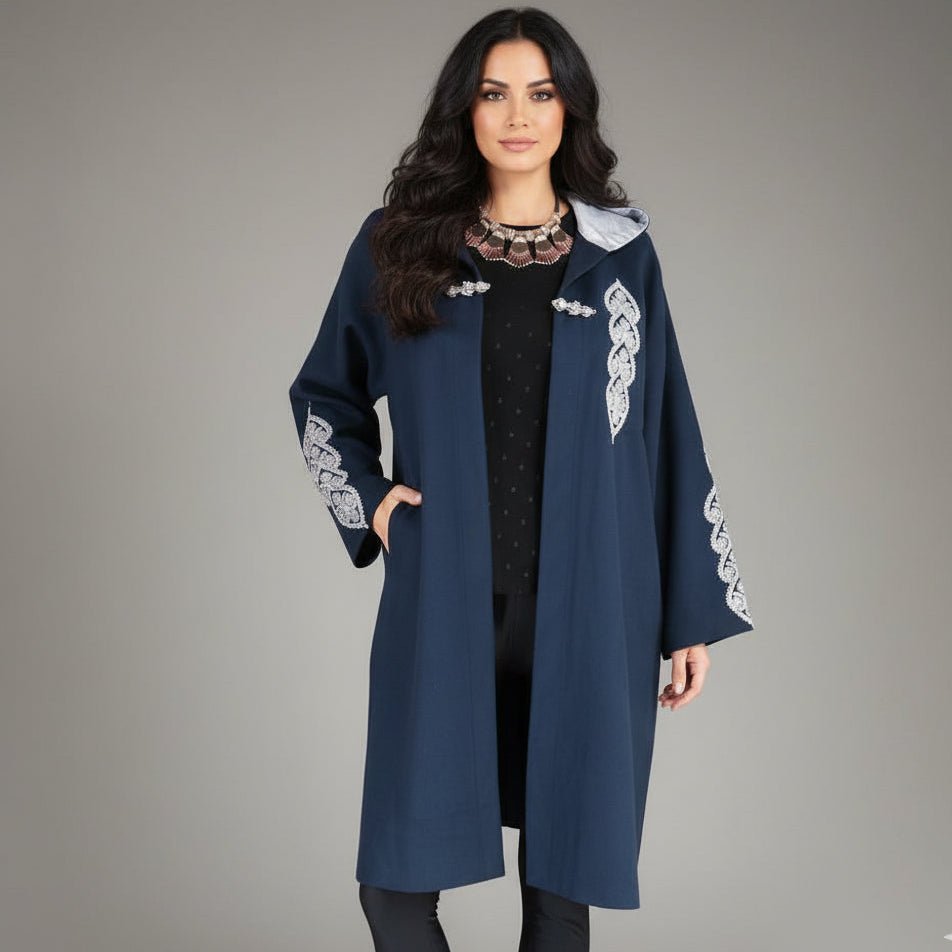 model wearing the heritage handmade hooded coat with embroidery 
