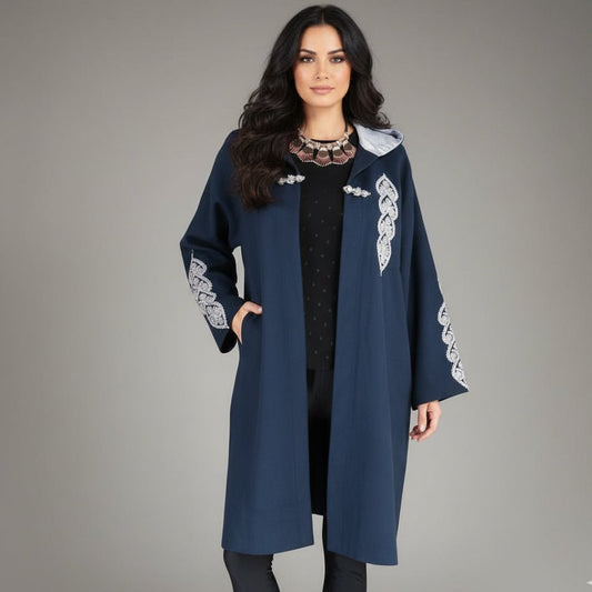 model wearing the heritage handmade hooded coat with embroidery 