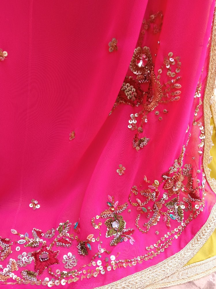Pink fabric with gold and multicolor embroidery