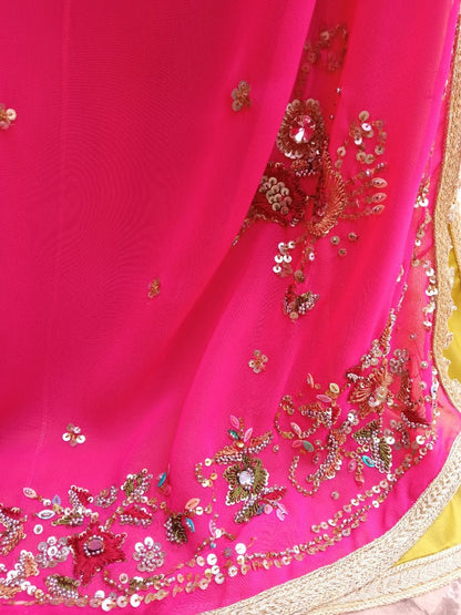 Pink fabric with gold and multicolor embroidery