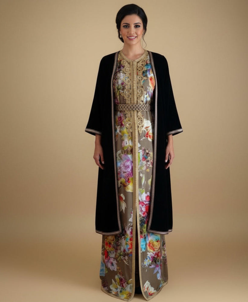 Woman wearing a black and floral dress with a beige background