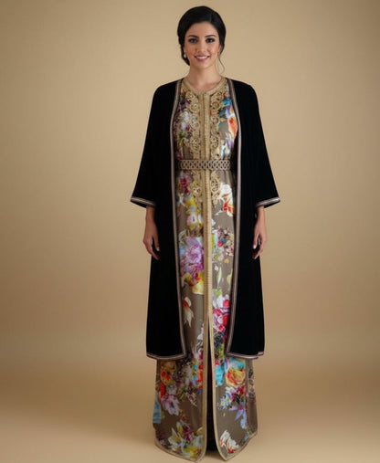 Woman wearing a black and floral dress with a beige background