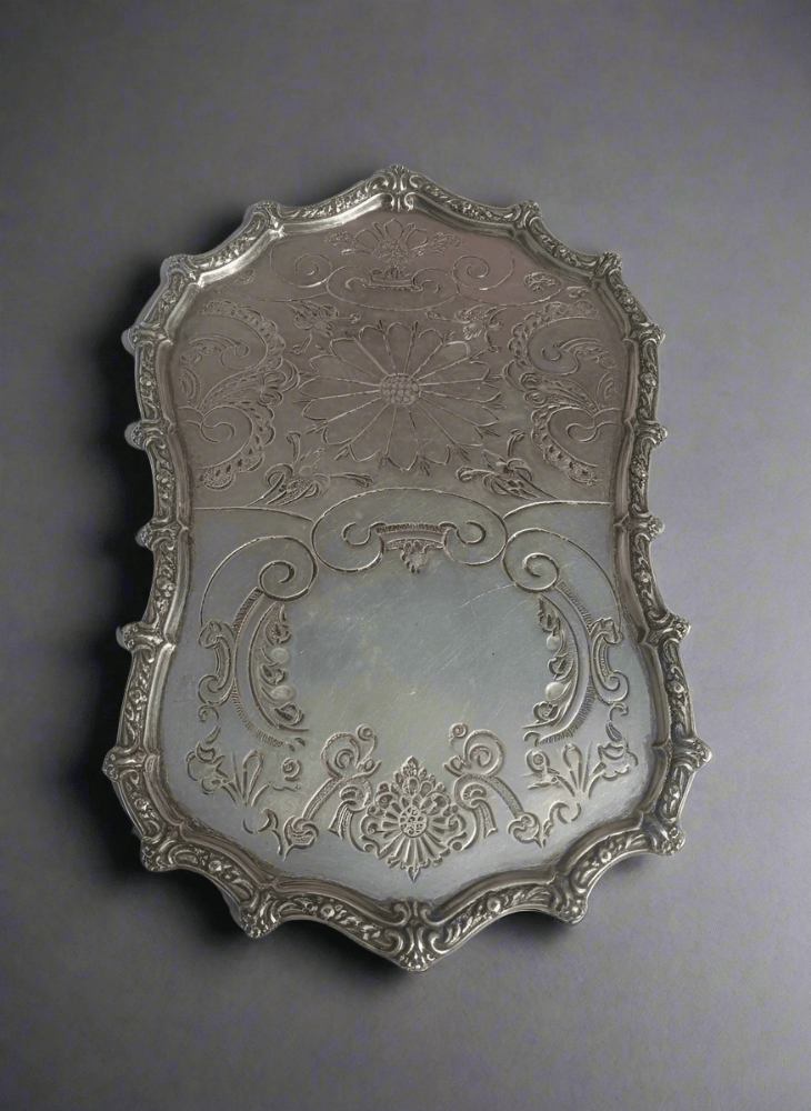 Decorative Moroccan vintage tray with intricate designs on a white background