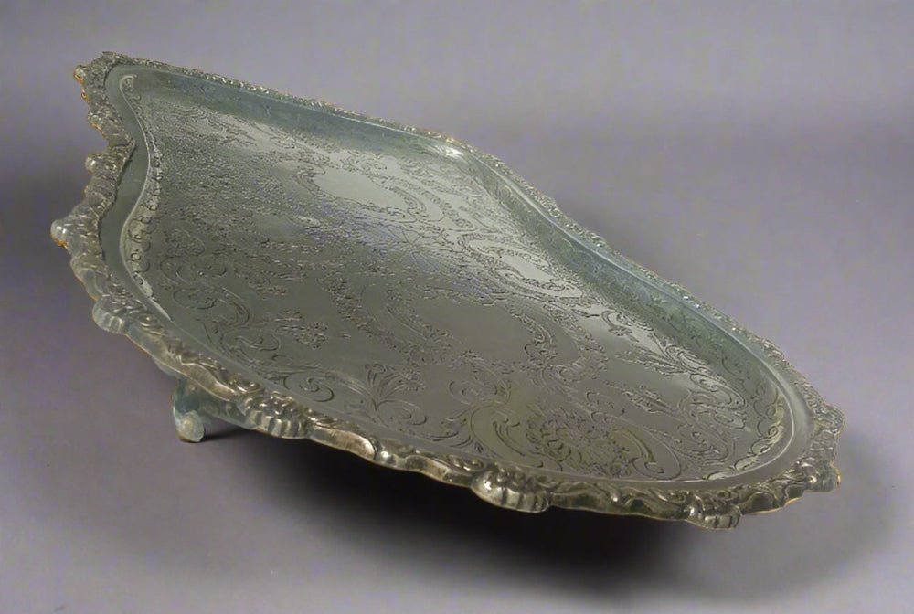 Decorative silver tray on a white surface