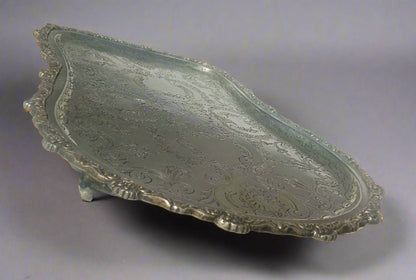 Decorative silver tray on a white surface