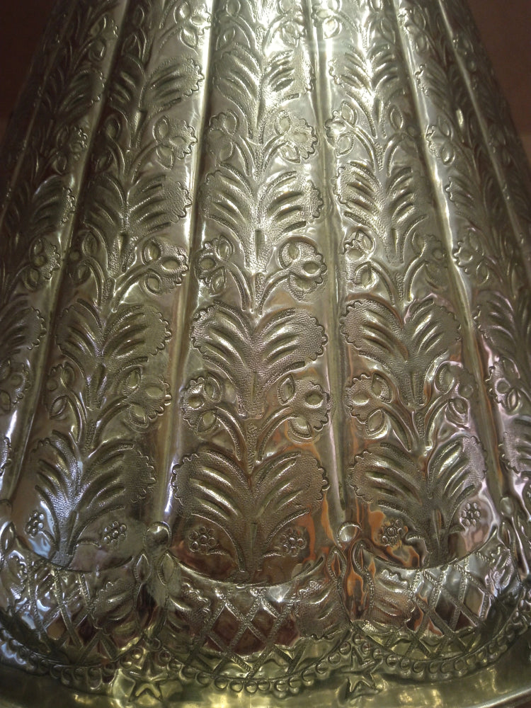 Close-up of a metallic 19th decorative moroccan tagine with intricate embossed design