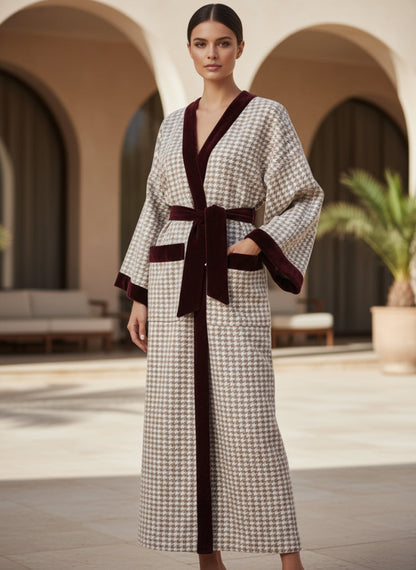 model wearing a long cachemere checkered coat with velvet 